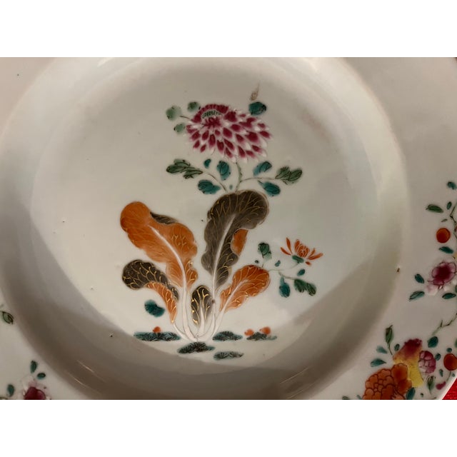Antique 18th century Chinese export porcelain plate. Decorated in famille rose palette with . Measures 9" diameter. Good...