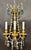 Fine pair of French gilt bronze and crystal Neoclassical style wall sconces with Louis XVI influence. Crystal and bronze...