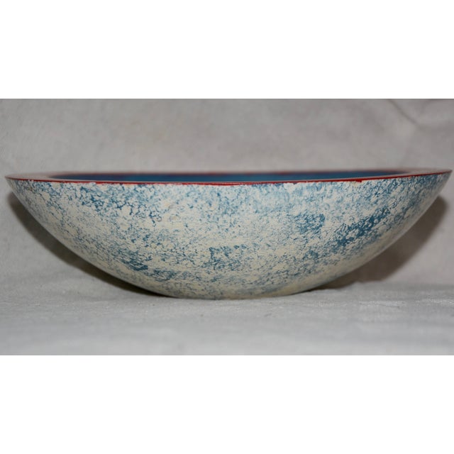 This is a unique wooden hand-painted bowl. This hand painted wooden bowl features a red rim with a white chicken on a blue...