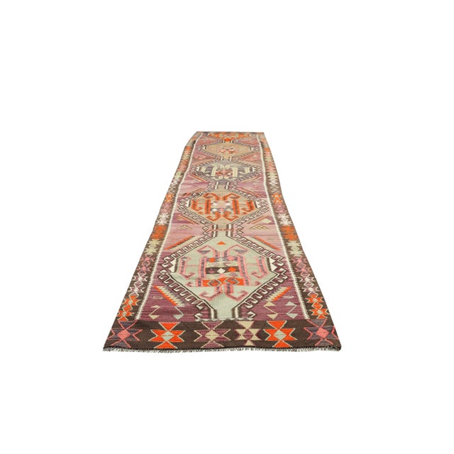 Decorative handwoven vintage kilim rug from Kars region of Turkey. Approximately 50-60 years old. In very good condition.