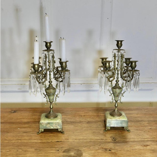 A Pair of Green Marble and Brass 5 Branch Candelabra A beautiful pair to enhance your dining Table or sideboard, the...