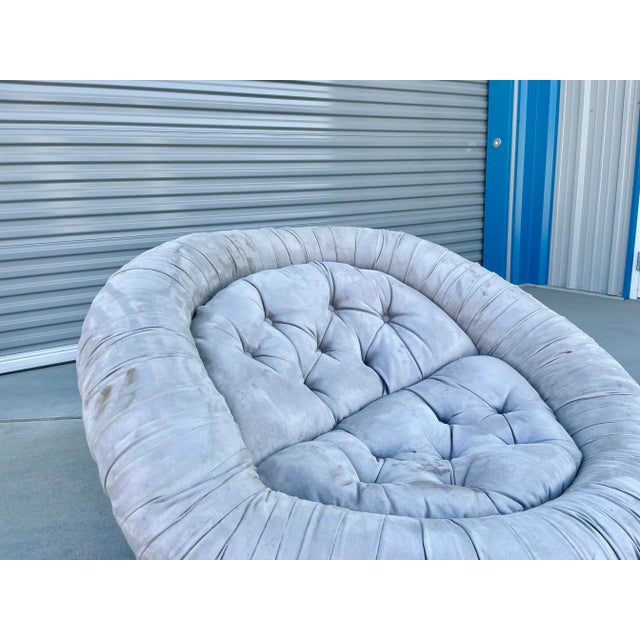 Vintage suede "cloud" chair designed and manufactured in Italy, circa 1970s. This beautiful chair is wrapped by a padded...
