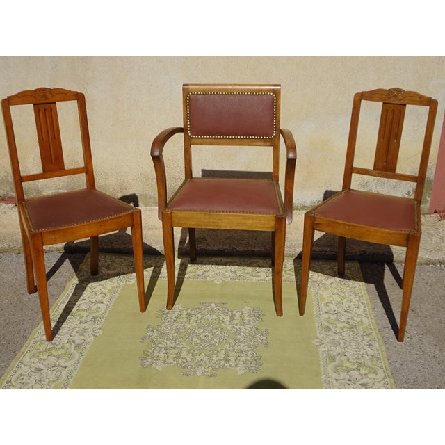 Set of two chairs and one armchair in stained beechwood. Antique Art Deco style, 1930s/1940s. Chairs with openwork wooden...