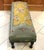 The creamy, sage green and goldenrod coloring of this needlepoint’s background, suits the delicate florals of pink, wine,...