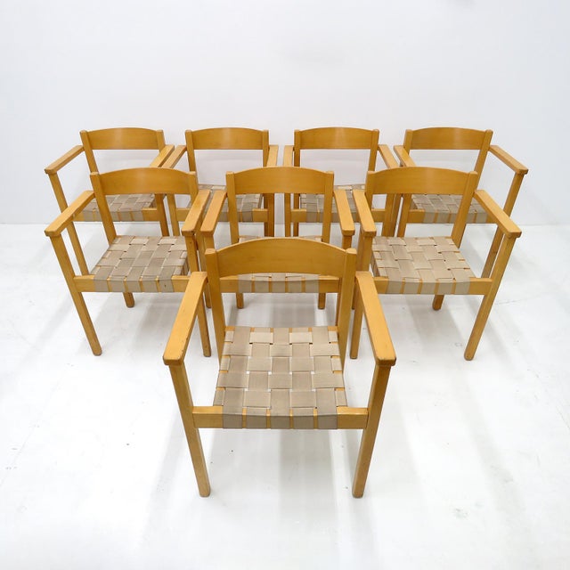 Wonderful set of eight 1970s dining chairs by Axel Larsson for Balzar Beskow, with arms, in birch with straps of hemp,...