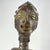 This finely carved Songye standing figure exemplifies the powerful sculptural language for which Songye art is renowned....