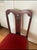 A charming antique Federal-style mahogany side chair featuring an elegant shield-inspired back, carved shell crest detail,...