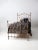 An exceptional antique Victorian iron twin bed dating to the late 19th century. The headboard and footboard feature...