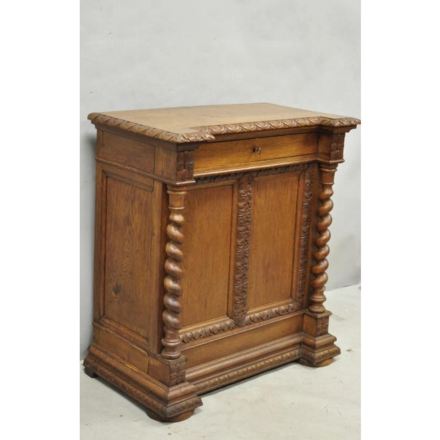 Antique Renaissance Revival Oak Wood Spiral Barley Twist Jelly Liquor Cabinet. Item features a single dovetailed drawer,...
