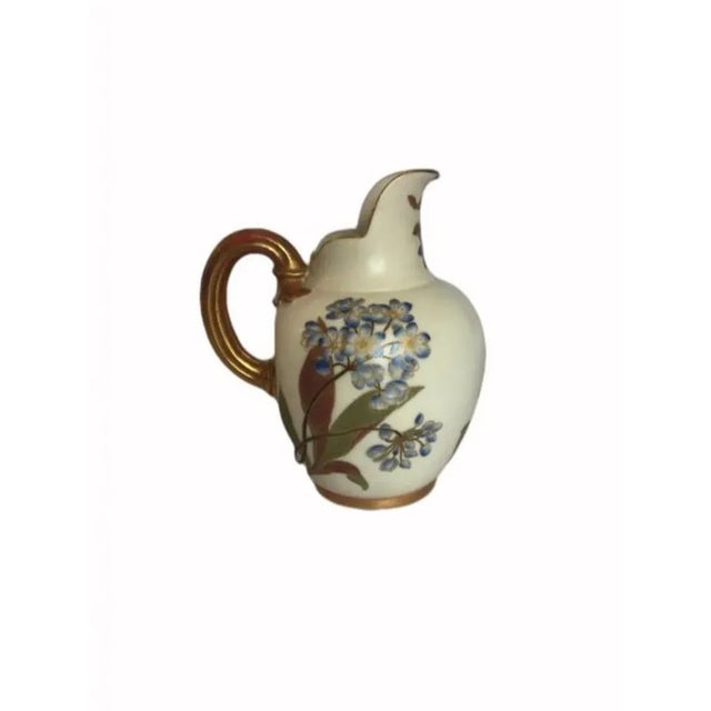 Quality antique Royal Worcester jug. Quality hand painted and gilded handle, Blue, Green, Brown and Gold coloured flowers...