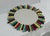 Round wall mirror, unique piece Wooden frame, upcycled project made from wood scraps with colorful earth tones. The mirror...