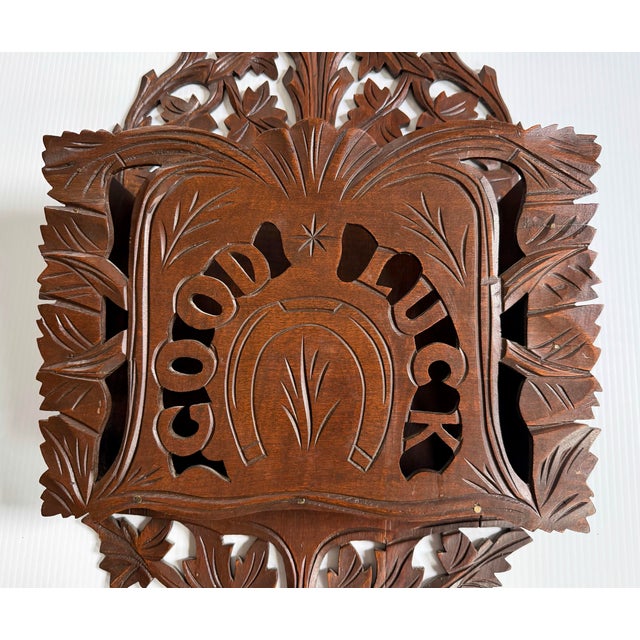 Charming, rare and very large hand carved wall pocket.