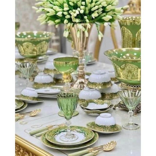 The gorgeous antique European serving bowl is decorated with a green and gilt pattern featuring a center medallion with an...