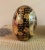Offering a well sized vintage Cloisonné Satsuma egg featuring palace scenes with geishas and gold gilt lotus blossoms on a...
