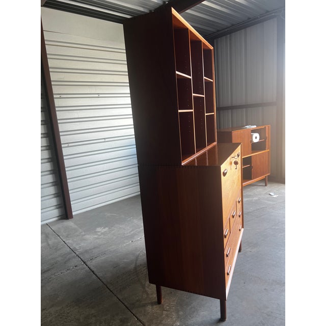 Beautiful credenza and hutch. Tambor doors and bookcase hutch. Doors slide easily. A forest addition for your home.
