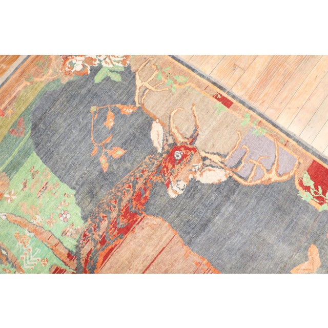 An early 20th-century high-quality Russian Karabagh pictorial rug depicting a happy go luck deer Measures: 4'5'' x 6'9''.