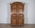 Magnificent 18th-century French buffet deux corps crafted in solid blond oak with richly molded paneling and an arched...