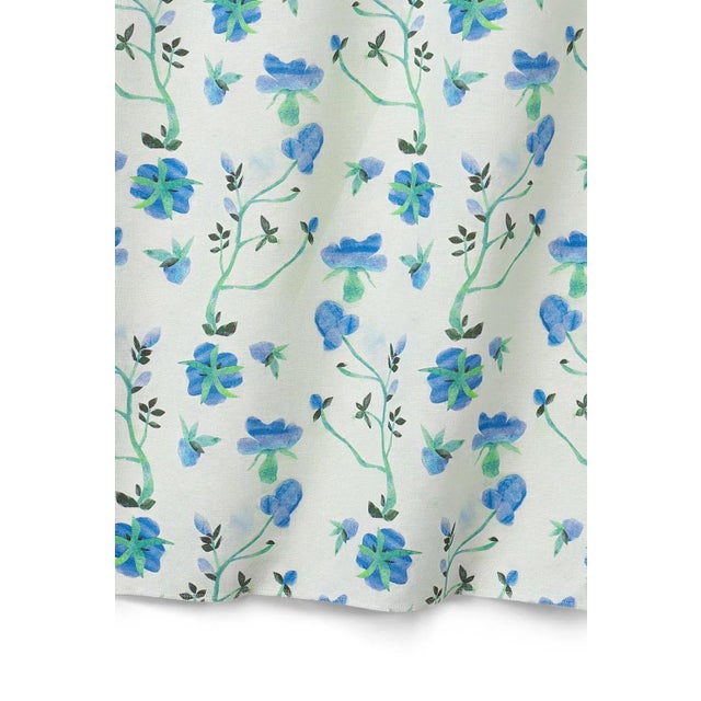 Depicting cutouts of flowers and stems on a pastel background, this sweet floral fabric is a loose representation of...