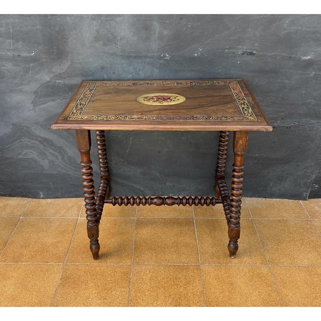 Elegant Spanish side table crafted in solid wood, featuring beautifully turned barley twist legs connected by matching...