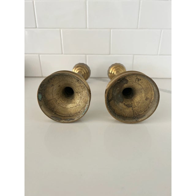 This unique pair of brass candlesticks would add character and dimension to any mantle, bookshelf, table or display space....