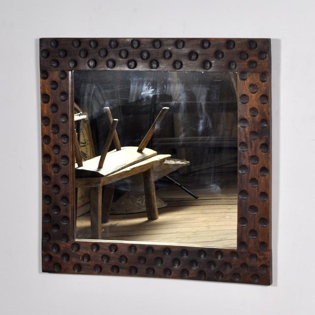 Brutalist mirror from the 1970s with a solid oak frame. The robust design with characteristic relief details gives this...