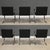 A set of six mid century modern black leather dining chairs with chrome frames designed by Mies Van Der Rohe and licensed...