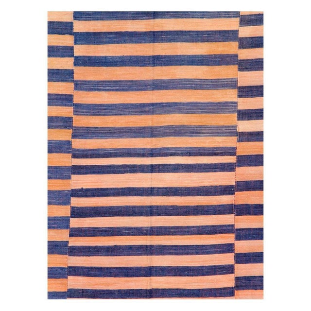 A vintage Turkish flat-woven Kilim rug handmade during the mid-20th century. 3 offset sections with variating colors in...