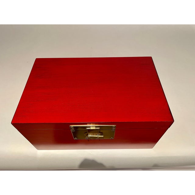 Chinese red and black lacquered box with fine brass mounts in the Chinese Export style. Lovely color. A refined and...