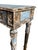 This beautiful carved, painted console is from the 20th century. It is a stunning pale blue with a floral relief design...
