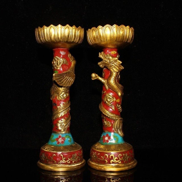 This is a striking vintage pair of Chinese cloisonné enamel candlesticks, featuring a dragon and phoenix motif. Each...