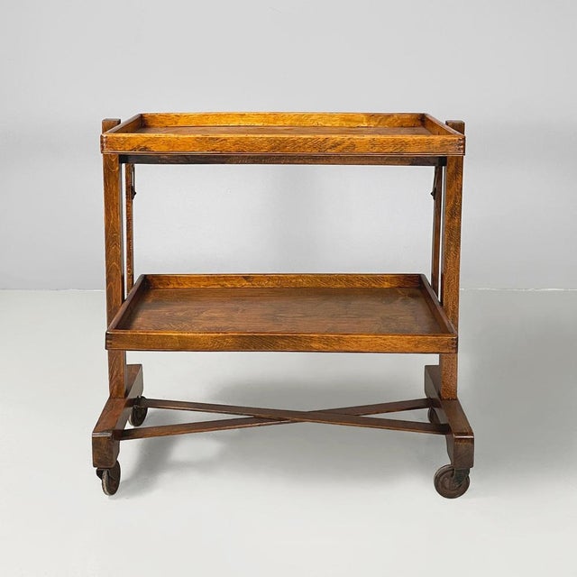 Italian art deco foldable cart with 2 shelves in wood, 1930s Cart with double rectangular shelves, entirely made of wood....