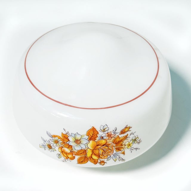 A darling little piece of retro cottage charm! This vintage milk glass ceiling light shade features three cheerful floral...