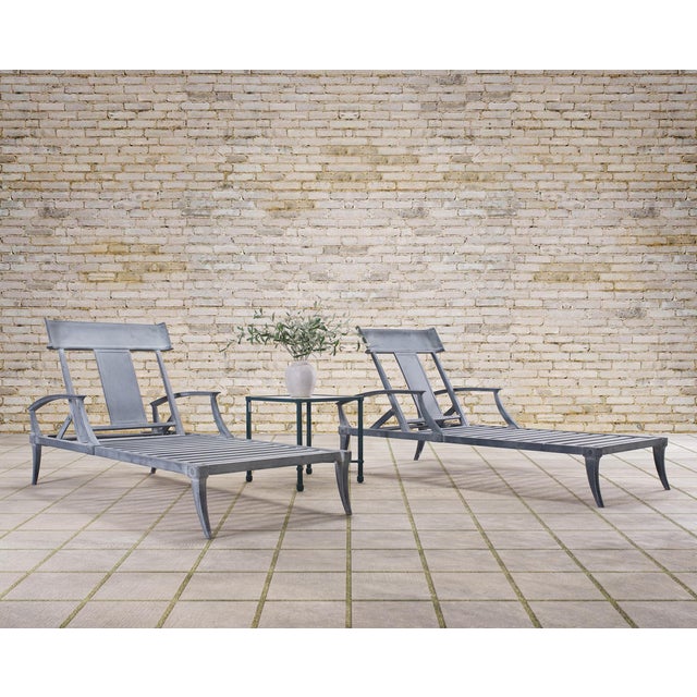 Amazing pair of dramatic Klismos chaise lounge chairs crafted from cast aluminum by Restoration Hardware (Now RH). The...