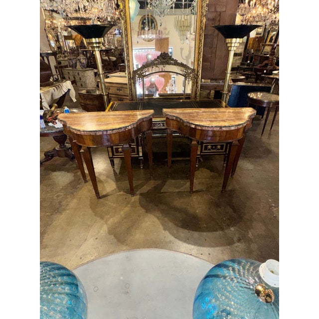 This product is a pair of elegant early 19th century Italian Tuscan walnut consoles, adding a touch of antique charm to...