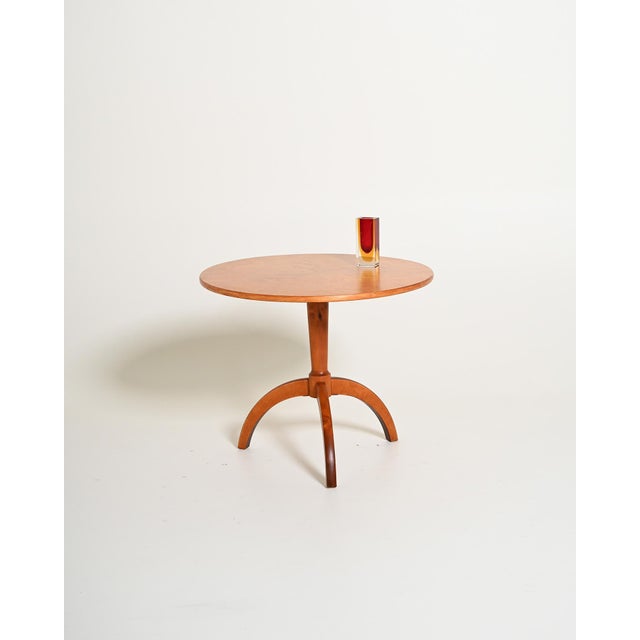 Elm wood frame with a circular top, a central column, and a three-star base. Made in Sweden, 1940s. Made in Sweden in the...