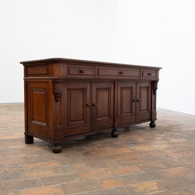 Antique pitch pine restaurant serving cart, dating from the early 20th century. It features four doors and three drawers...