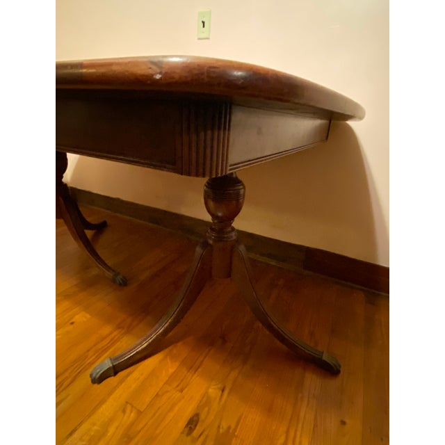 Vintage Brown Wood Double Pedestal Dining Table. Placemats & coasters would help protect table from heat & water marks....