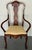 An elegant late 19th-century Dutch marquetry open armchair, beautifully crafted in richly figured mahogany with finely...