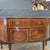 This English Bowfront Mahogany Satin Banded Sheraton Style Sideboard on tapered legs with spade feet is a beautiful...