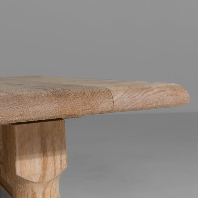 This 1970s French Brutalist oak coffee table exemplifies the movements emphasis on sculptural form and material honesty....