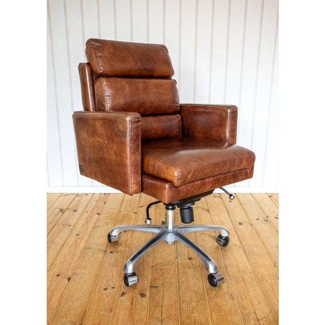 A very smart and extremely comfortable executive leather designer desk armchair in lovely condition. Designed by british...