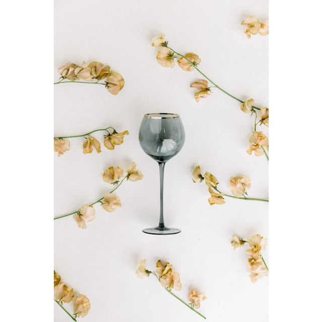 Set of 4 white wine goblets in Charcoal with gold rim. Sleek stem, bulbous mouth, 16 oz. Deep gray tones create contrast...