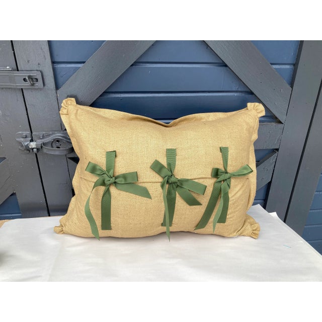 A pillow newly made from a circa 1880s printed cotton, backed and edged with a coordinating raw silk, with a grosgrain...