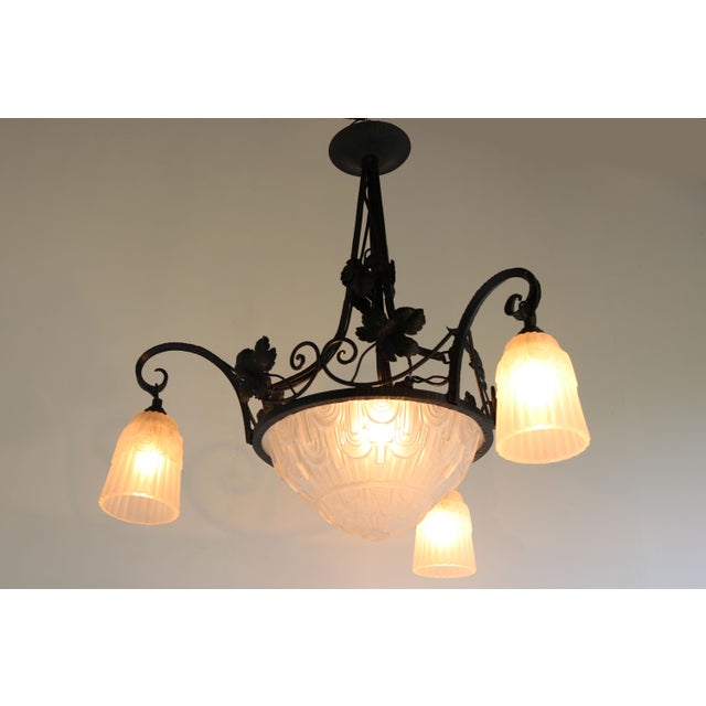 Exquisite Antique French Art Deco chandelier in wrought iron & geometric glass 1930. Marvelous piece of craftsmanship the...