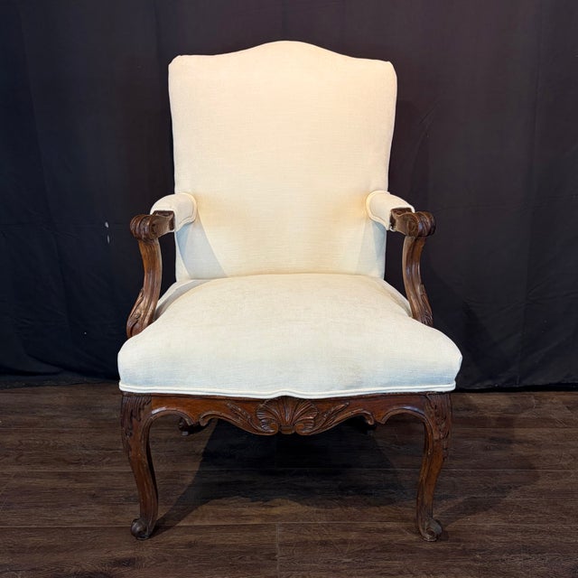 Elegant pair of early 19th century French Louis XV fauteuil armchairs with finely carved walnut frames and new neutral...