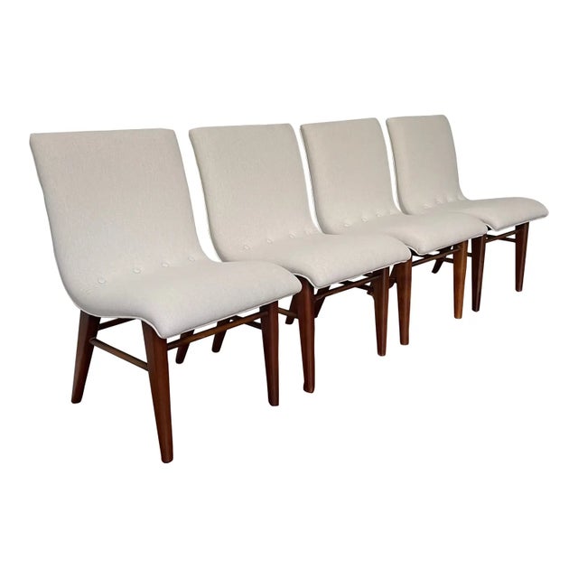 The solid walnut legs have been freshly refinished and seats recovered in an off-white linen fabric to imitate the...