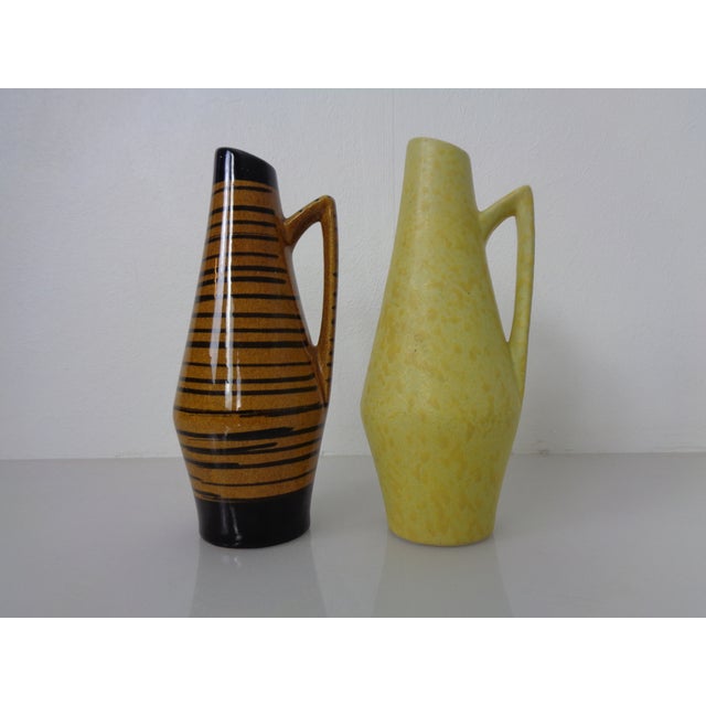 Two ceramic Henkel vases by Heinz Siery for Scheurich. Marked on the undersides. This piece has an attribution mark, I am...