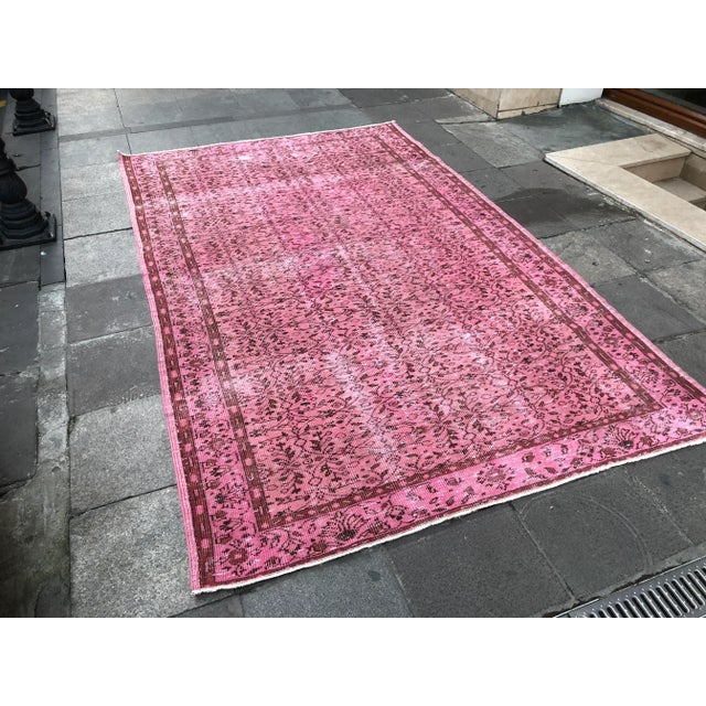 This is a vintage Turkish Oushak rug from the 1960s. The piece was hand-knotted.