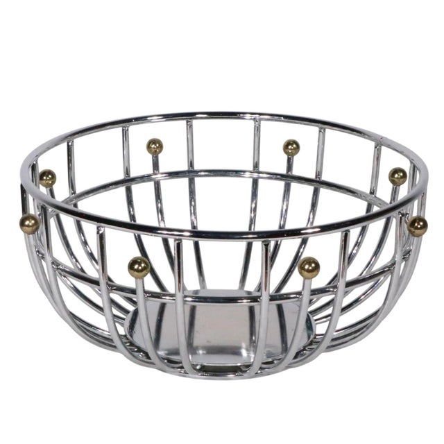 Chic modernist chrome and brass fruit bowl, in excellent, original, clean and ready to use condition. The bowl is...