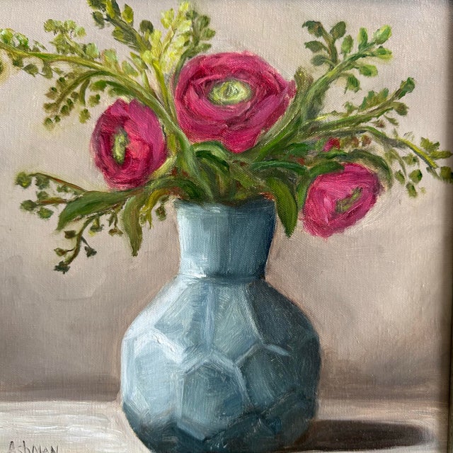 This 10x10 floral still life painting of purple pink Ranunculus Flowers in a gray blue honeycomb hexagon style vase,...